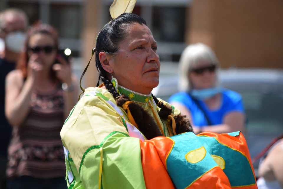 National Indigenous Peoples Day organizer Robin Berard says a prayer to the creator before joining an Indigenous dancing demonstration