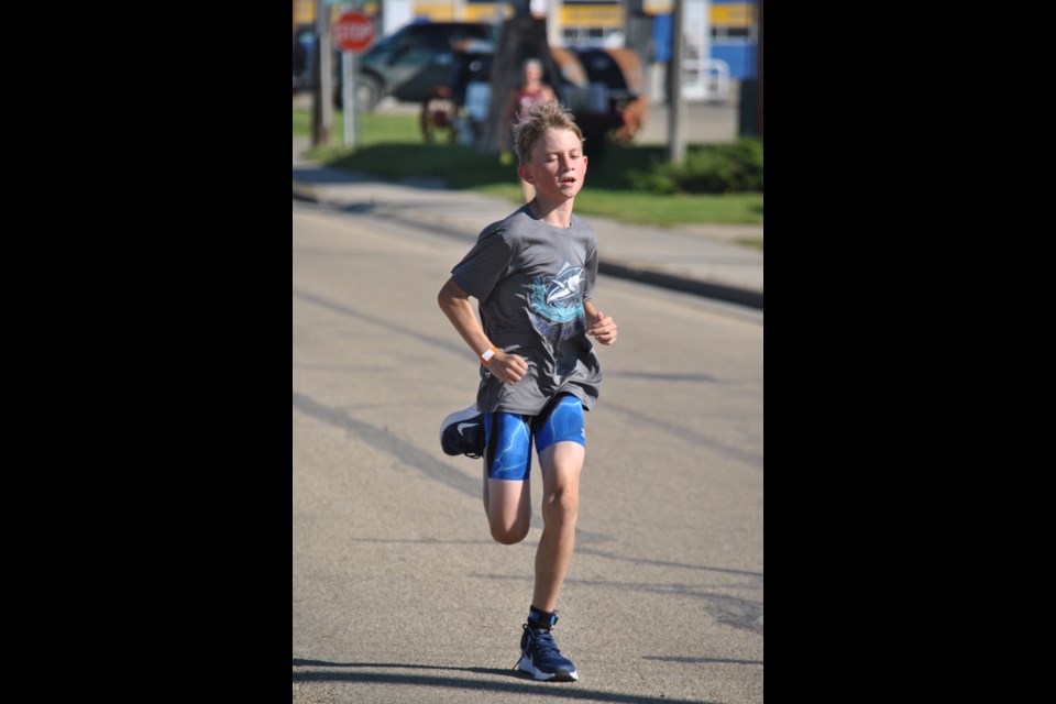 William Thomsen with the finish line in sight as he completes the final leg of the Tri on the Trail Triathlon.
