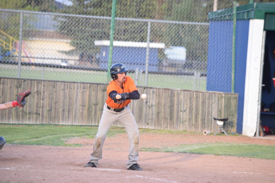 Barrhead Orioles catcher Johnney Klein attempts a bunt to get on base.