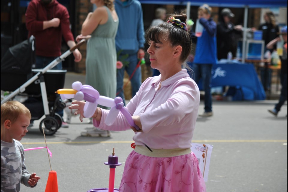 Sharron Price of the Balloon Fairies continuously had a waiting line to get one of her balloon animals, hats, or swords.