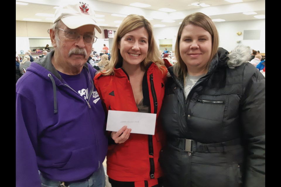 Elks exalted leader Hugh Thomson presents a $2,000 cheque to Jennifer Woynorowski and Jennifer Tober of the Westlock Pre-school Society Jan. 20.
