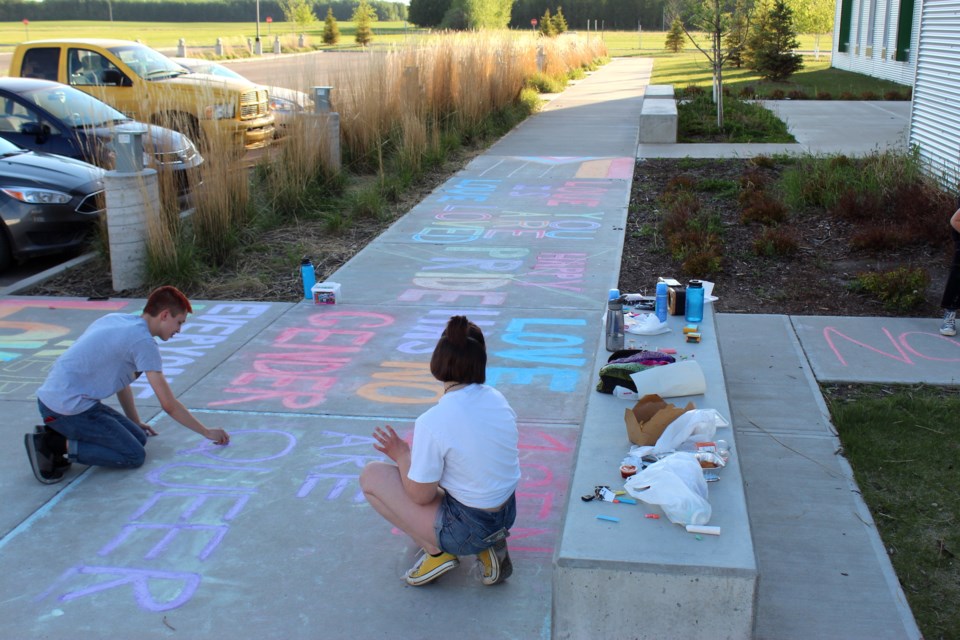 Several students at Edwin Parr Composite got together to create some chalk art at the school at the beginning of June to celebrate Pride Month. It was later defaced by other students.