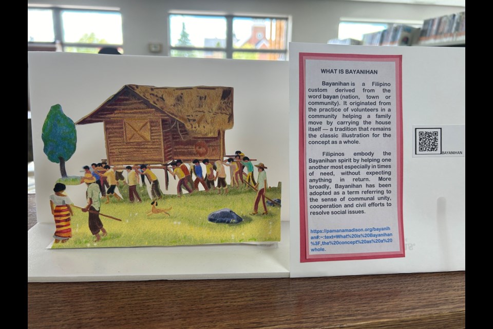 Yet another display talks about the tradition of bayanihan, wherein volunteers help a family move by carrying their whole house.