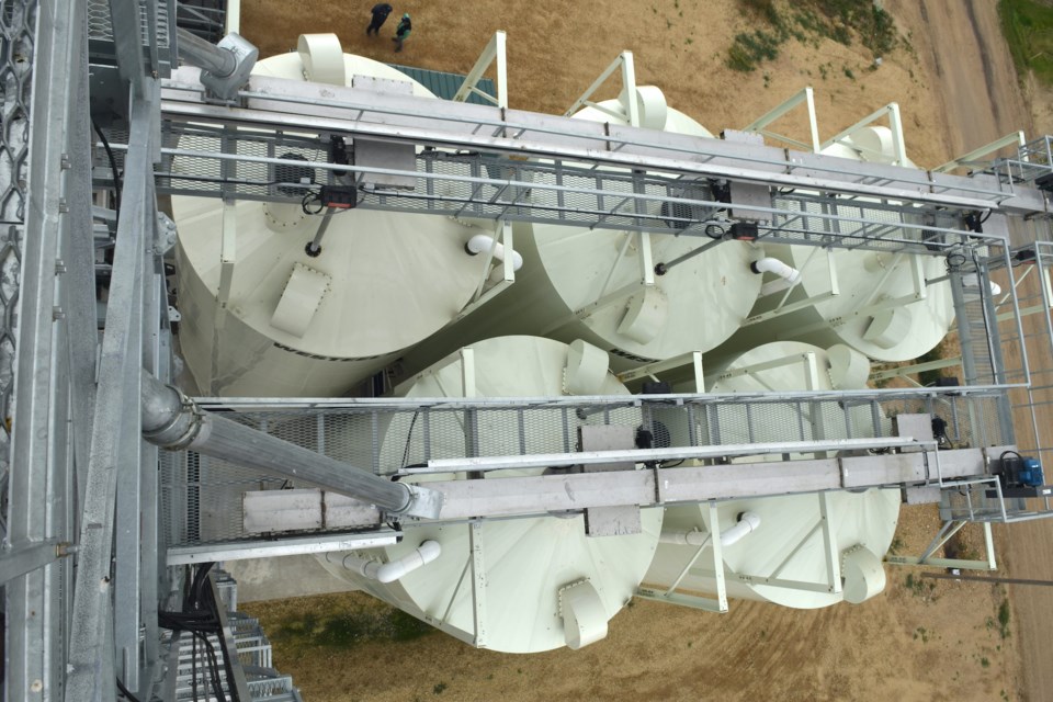 A picture of the Nutrien Ag Solutions fertilizer storage tanks taken from above. One of the improvements of the new plant is the staircase and walkway system that replaced the old 'bucket elevator systems' used in the old plant.