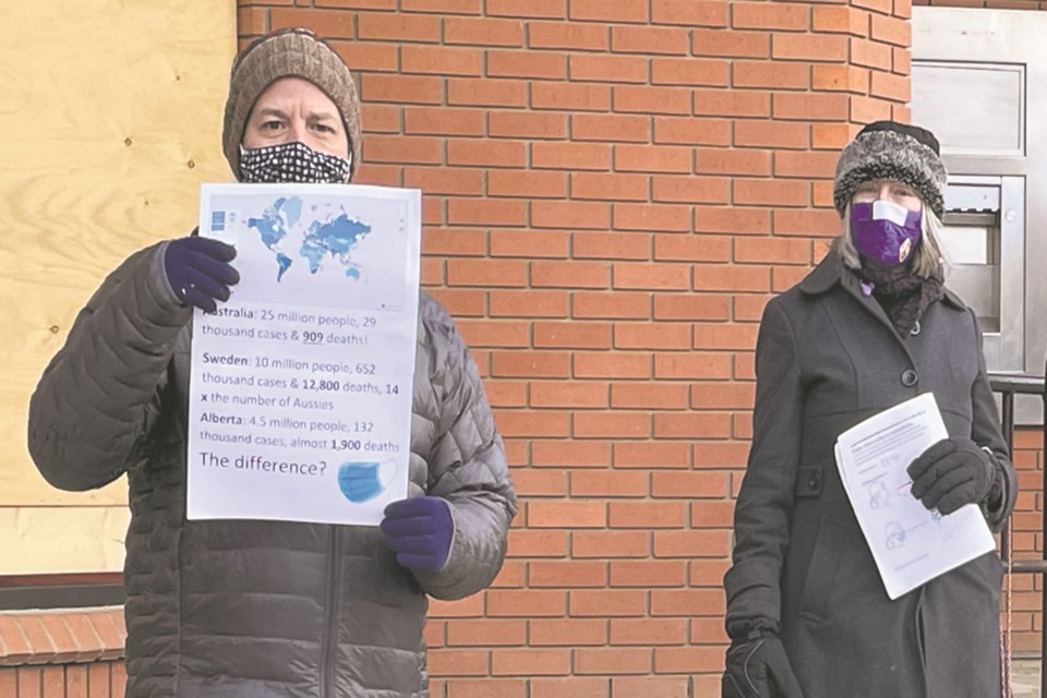 Athabasca town council heard from two separate delegations April 20, asking them to take a firm stand on not allowing anti-restriction rallies in the town. Daniel Schiff and Monica Rosborough, pictured at a small counter-protest during the first rally in Athabasca in February, laid out their cases to council.