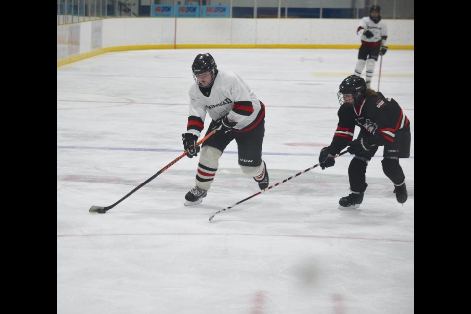 Barrhead's Tanner Semler goes wide to get past his Westlock opponent in the team's second game. Unfortunately for Barrhead, they lost 9-4.