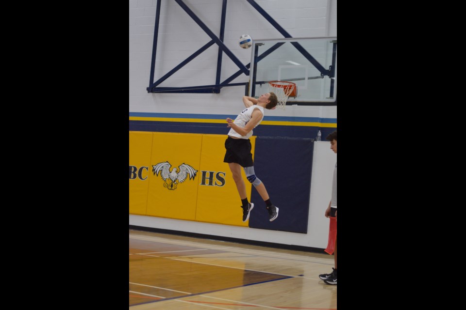 Barrhead Gryphon Gavin Moes with a jumping serve in the 3A North Central Zone championship match.