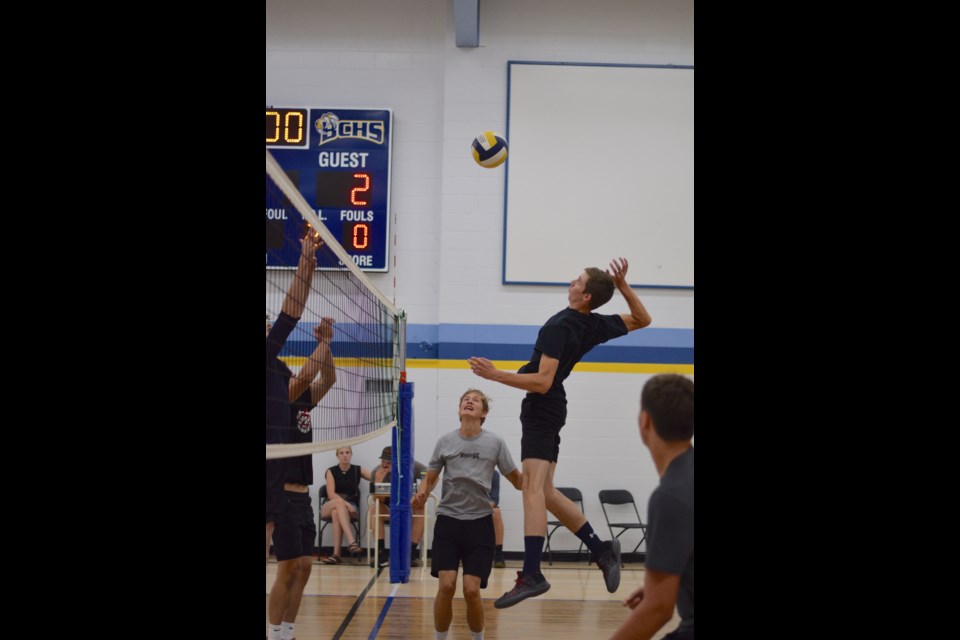 BCHS player Gerrit Koekkoek smashes the ball in a Sept. 3 game against the Quinn M alumni team. After winning the first set, the BCHS squad lost the next two sets. 