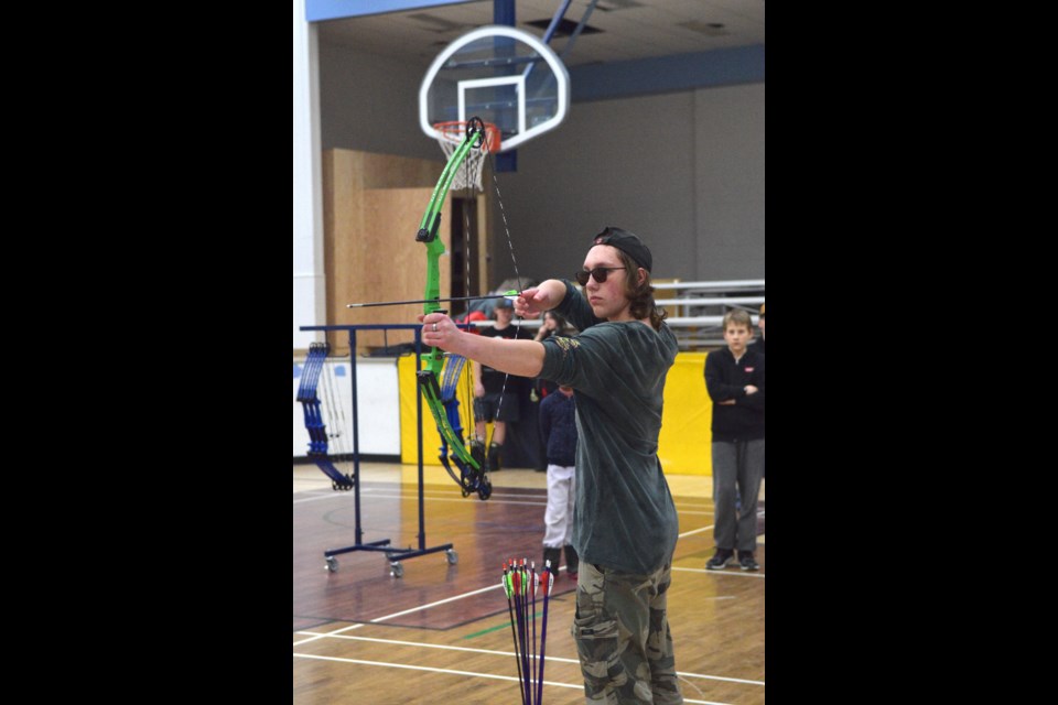 Grade 10 BCHS student Hayden Rochon in addition to being a member in the archery club he also serves as an assistant coach. Here he is on the line at a Jan. 22 practice session. 