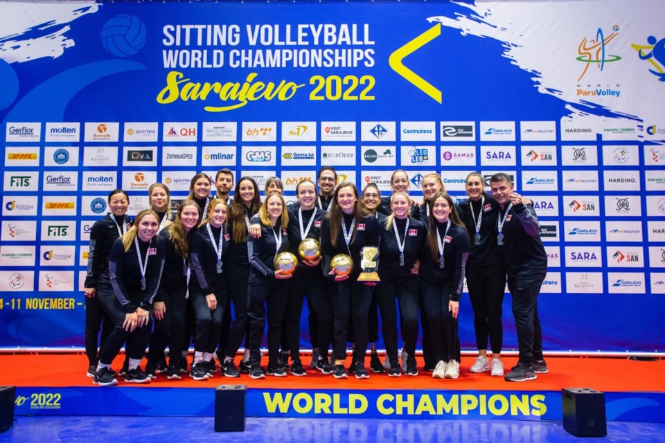 Heidi Peters (front row, fourth from right) poses with her Canadian Sitting Women's Volleyball Team teammates after winning silver at the ParaVolley Sitting Volleyball World Championships in Sarajevo.
