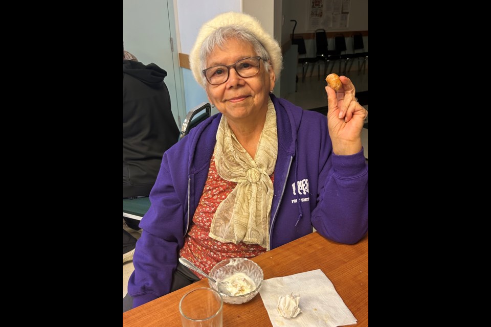 Marguerite Punko enjoys the free ice cream and hot dogs that were served that day. The food was donated by David and Sandra Truckey, who own and operate Apollo Pizza and the local Dairy Queen.