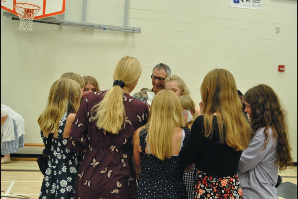 Former NPCS teacher Howard Gelderman was surrounded by some of his students during a night of celebration on June 23.