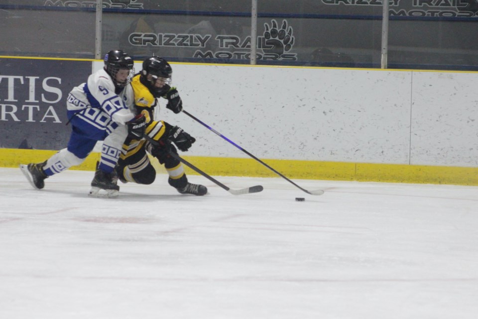 : Barrhead's Lucas Kent beats his check along the boards, bringing the puck into the Hinton zone in the second period.