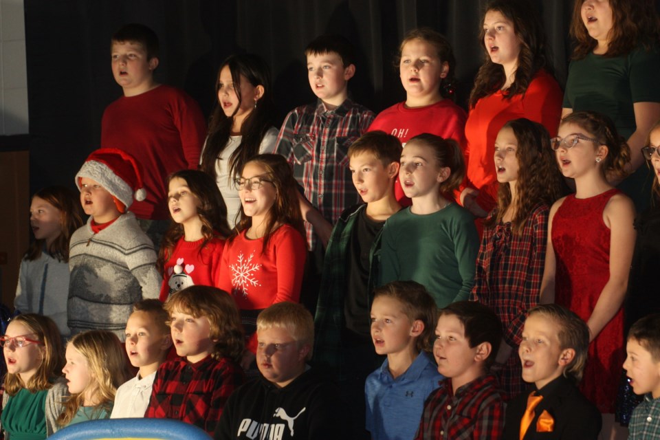 Grade 3 & 4 students at Eleanor Hall School in Clyde sing "The Frosty Hand Jive" during their Christmas concert on Dec. 14. The concert was centred around a play called "Jingle Bell Jukebox," which featured a number of holiday musical hits.