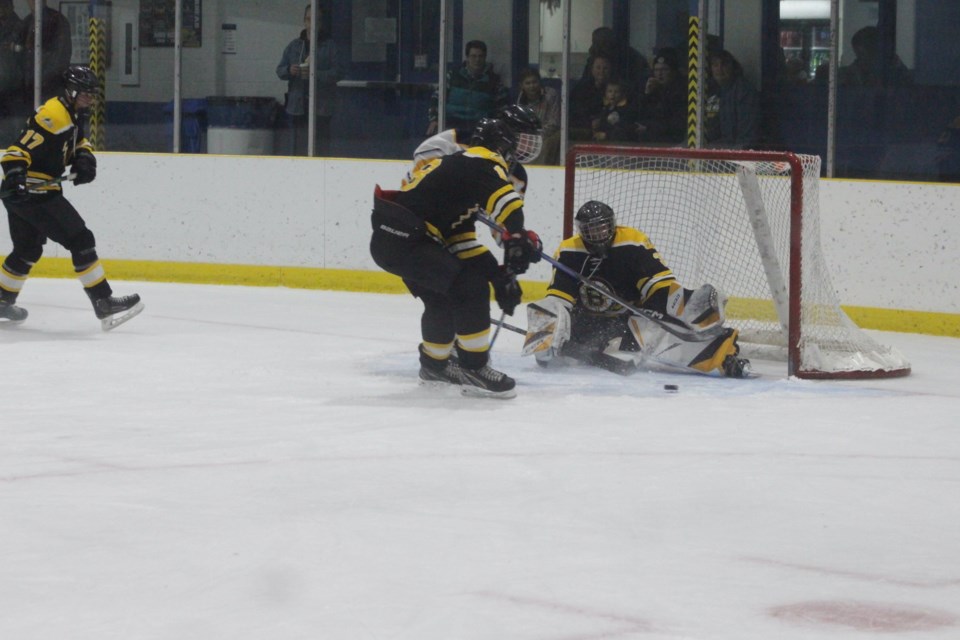 Barrhead Steeler guest goaltender Dallyn Petiot makes a save in the first period, while Trent Gravel prevents the Edson player from getting to the rebound.