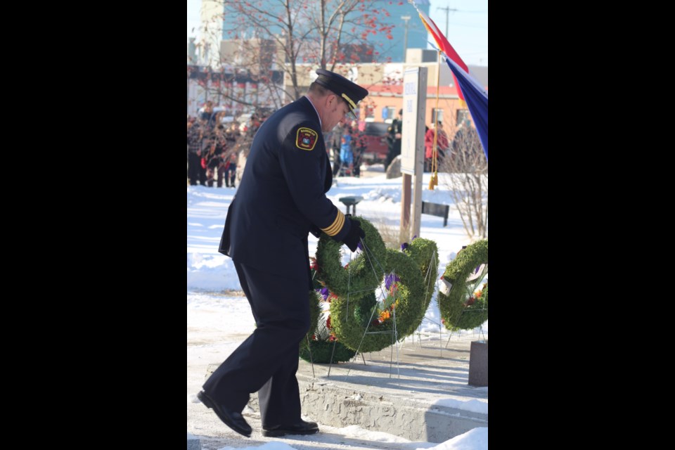 Fire chief Gary Hove prepares to lay a wreath on behalf of the Barrhead Regional Fire Services.