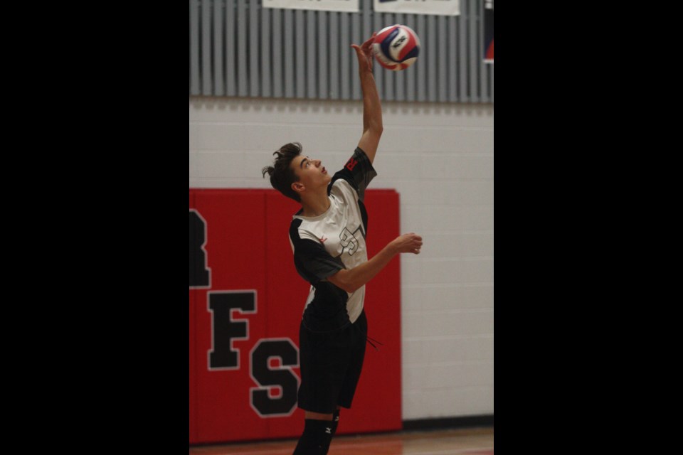 R.F. Staples T-Birds player William Despaul jumps to hit a serve while playing in the quarter final against St. Mary School on Sept. 23.