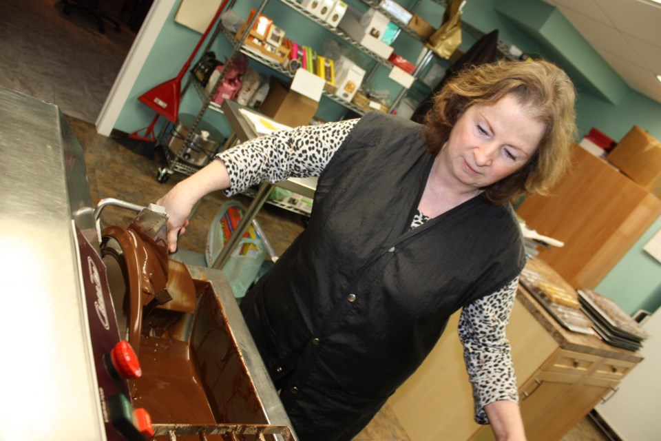 Inspiration Chocolates owner and head chocolatier Josie Hladki gets her temperer ready for another batch of sweetness.
Chris Zwick/AA