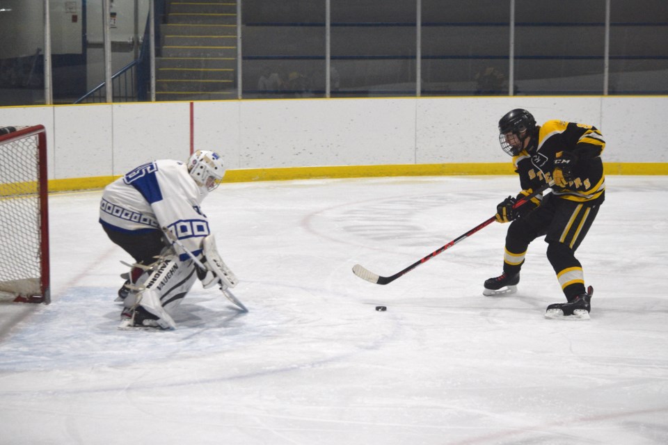 Kayden Rentz is about to score Barrhead's first goal on a second-period breakaway.