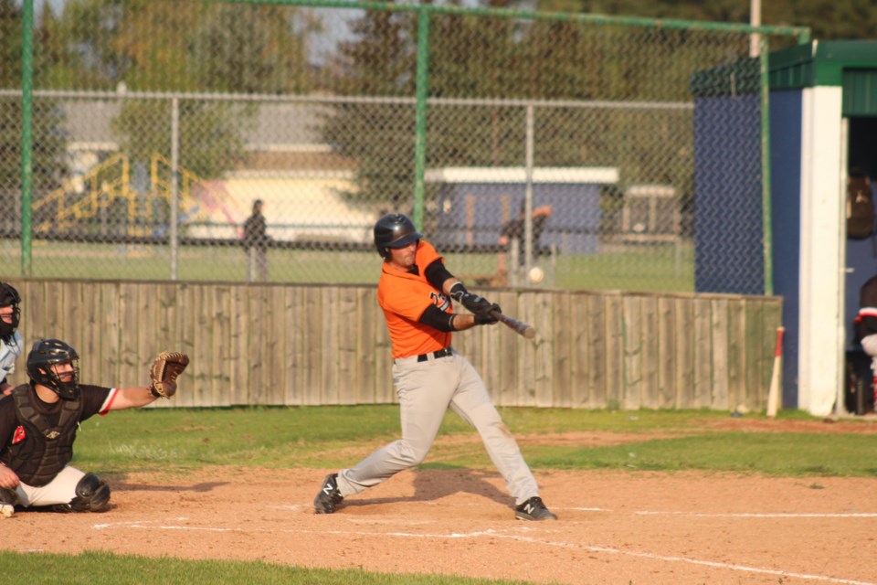 Barrhead catcher Lee Worbec hits a single in the bottom half of the fourth inning.