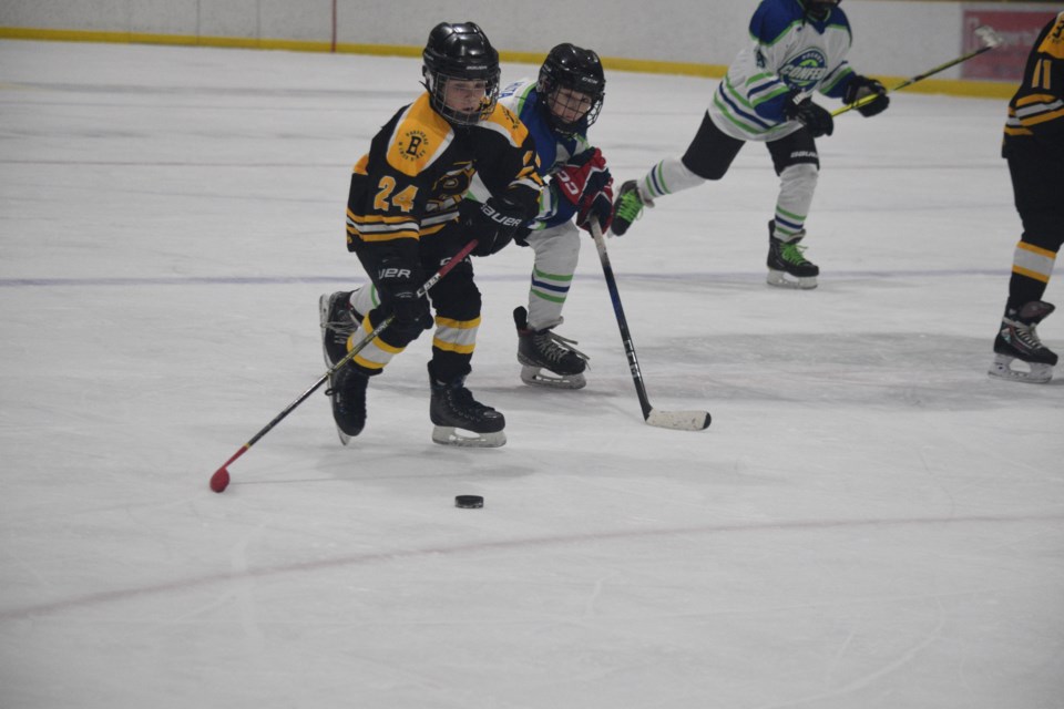Barrhead Bandit Lincoln Greff attempts to outdistance his Edmonton opponent.