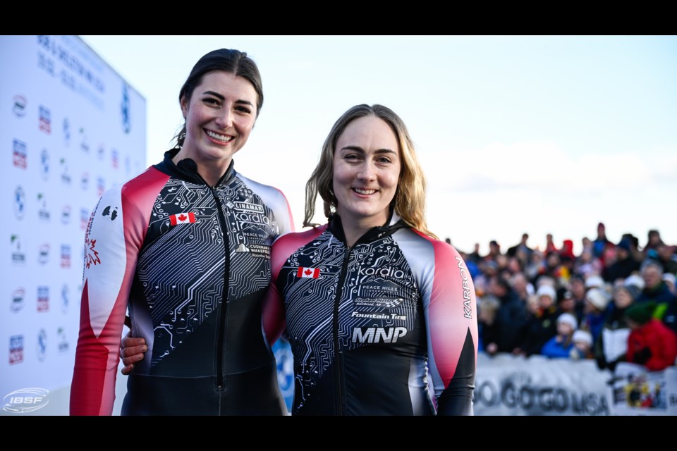 Melissa Lotholz poses with her brakeman Alex Klein following a run at the World Championships in Winterberg, Germany.