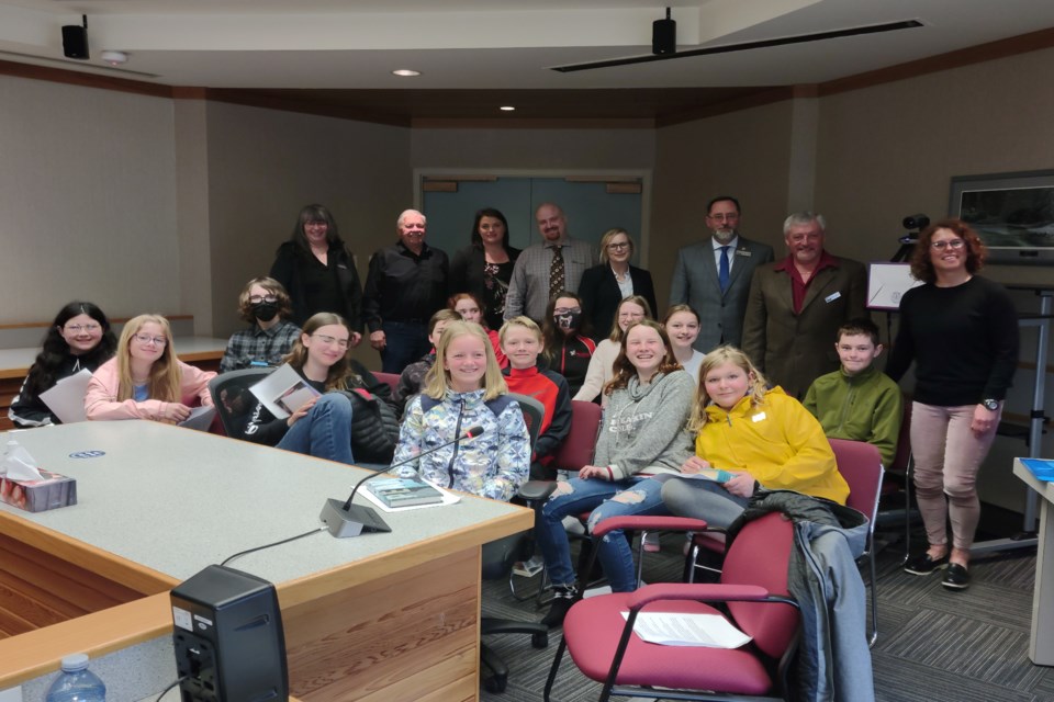 CUT: Athabasca County councillors pose with the Gr. 6F class from Landing Trail Intermediate School following their April 27 visit to council chambers following a peppering of questions about local government as part of their social studies class. 