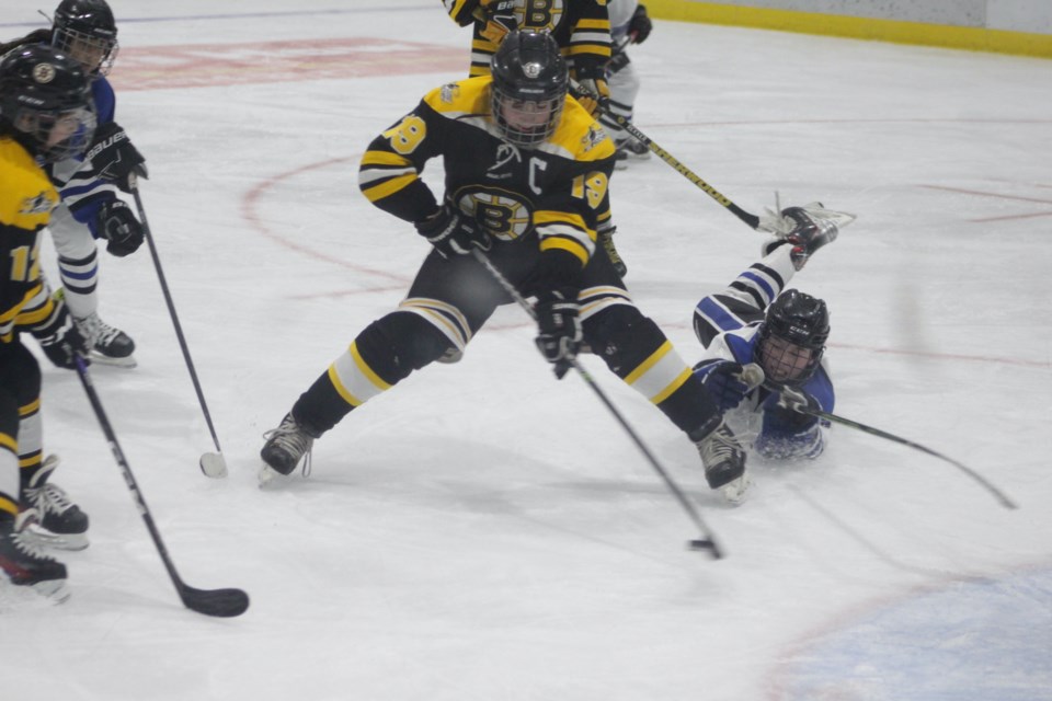 Barrhead captain Maddox Luciuk carries the puck between the circles just before he scores Barrhead's fourth goal.