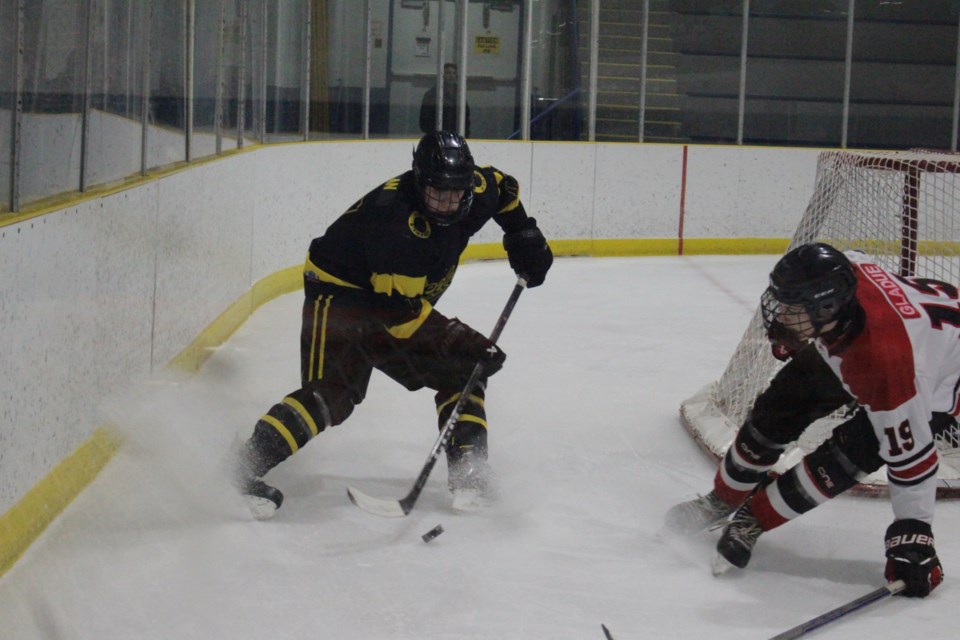 Steeler defenceman Magnus Kaplan looks for a teammate to pass to from behind the Vegreville net in the third period.