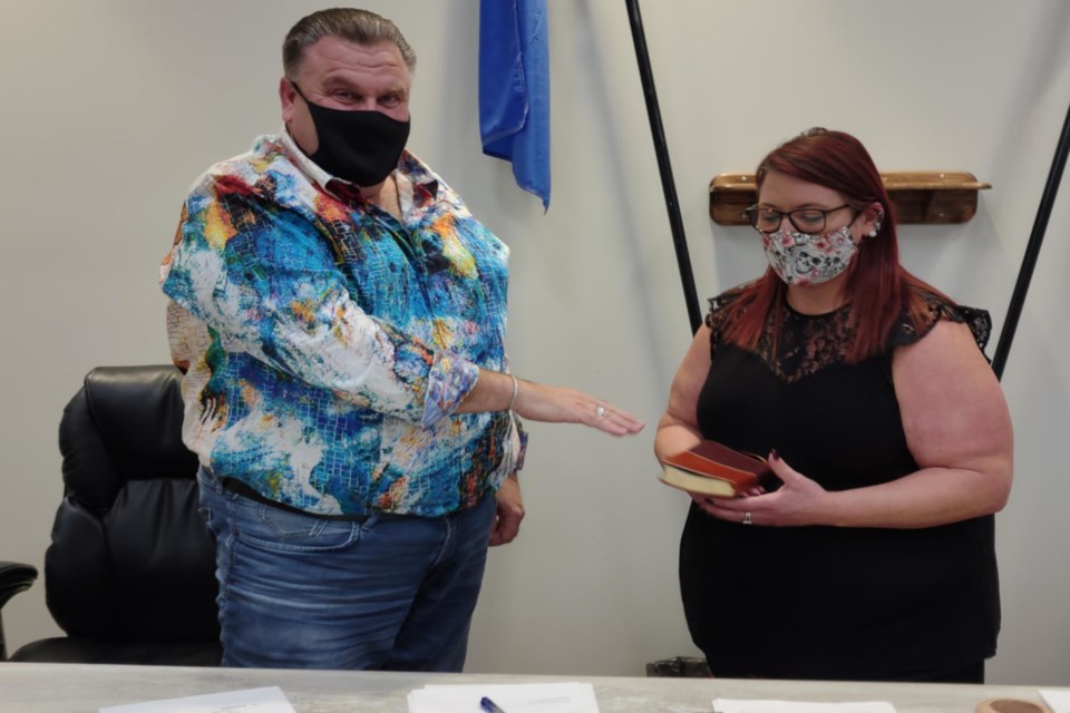 Colin Derko is sworn in by assistant CAO Tina George at the Village of Boyle’s Oct. 26 organizational meeting. Derko was later nominated to continue as mayor of the community. 