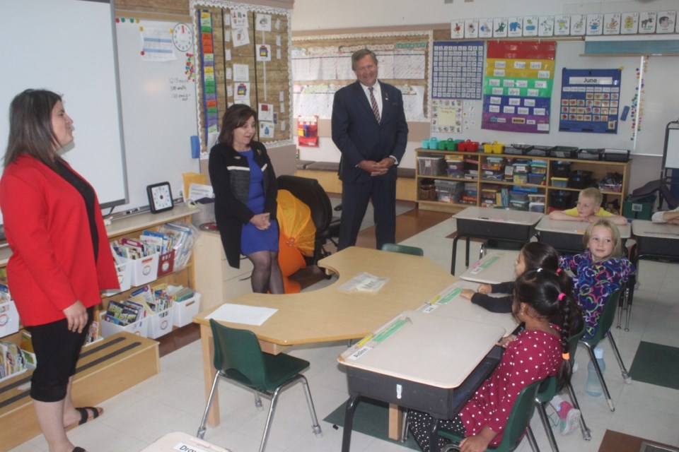 Minister of Education Adriana LaGrange, accompanied by Athabasca-Barrhead-Westlock MLA Glenn van Dijken, speaks to Grade 1 students at Barrhead Elementary School about her job on June 24. 