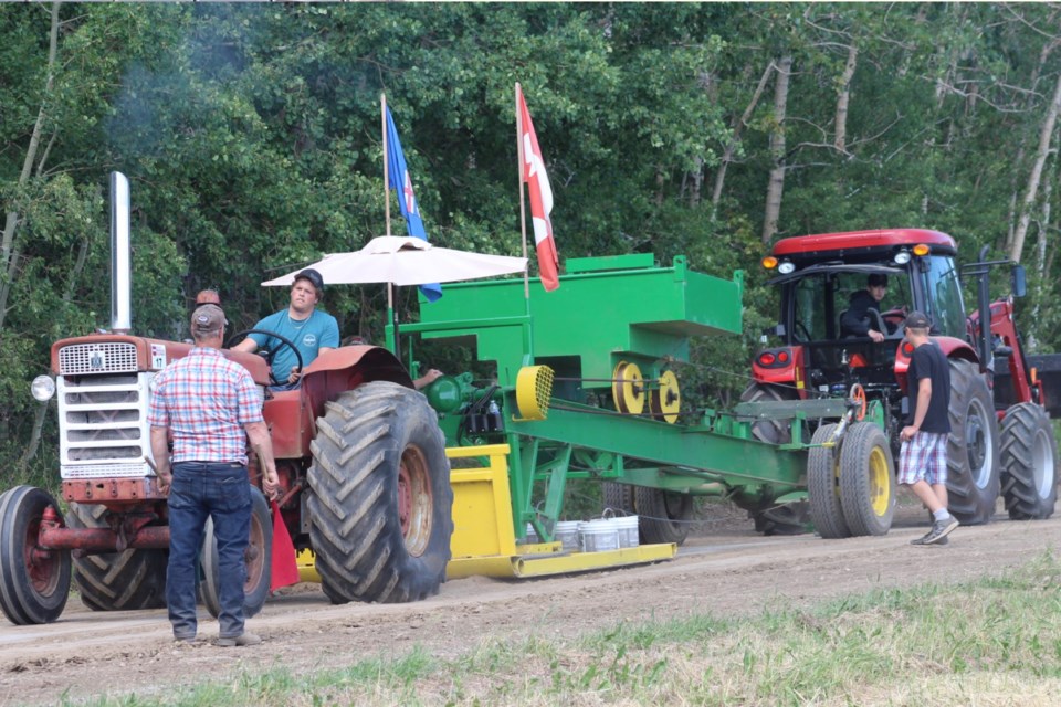 Damon Larson was driving a 1959 International 660 tractor in the tractor pull.