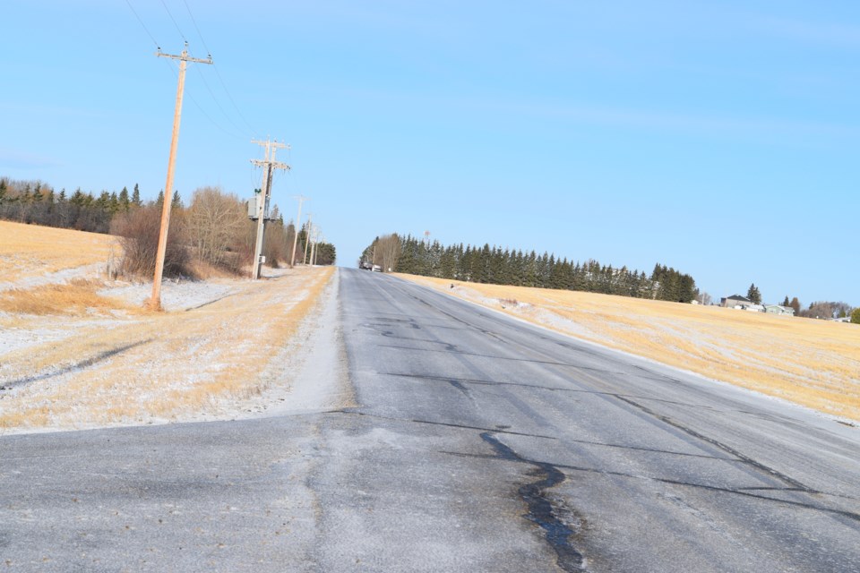 Many Barrhead travellers going into and leaving the community reported treacherous road conditions on the morning of Wednesday, April 17, due to an overnight dusting of snow melting and refreezing to area highways. Pictured is a portion of the Old Manola Highway (Township Road 594 at Range Road 33) coming into the Town of Barrhead.