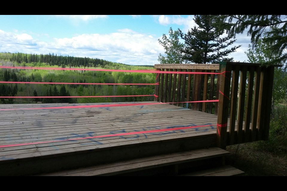 The viewing platform at Pirate's Hill Viewpoint on the Rotary Way trail system in Athabasca was spray painted and the railing was kicked off into the  embankment below.

Supplied