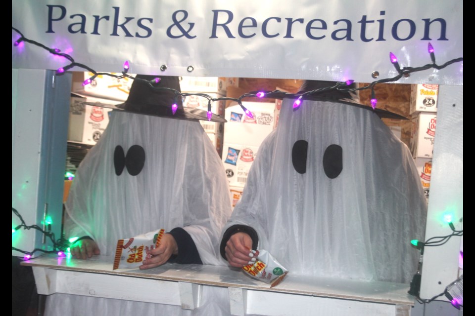 A pair of Peanuts-style ghosts handed out treats to children at the Town of Barrhead parks and recreation department's booth during the Pumpkin Walk.
