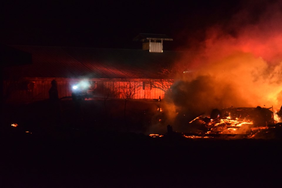 The remnant of a building after it was engulfed in flames due to a grass fire.