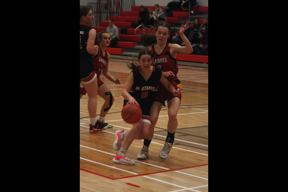 T-Bird Emma van Dijk moves the ball down the court while playing agains Sexsmith in the championship final.