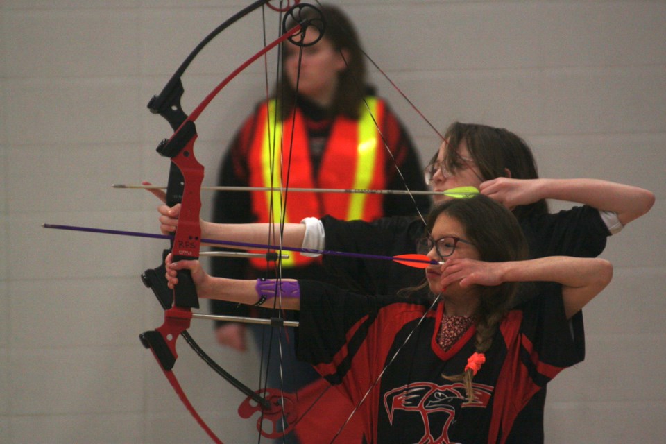R.F. Staples School student McKinley Kaufman readies to shoot at a target while taking part in the fourth annual Thunderbird Open on March 2. Approximately 211 archers took part in this day-long event.