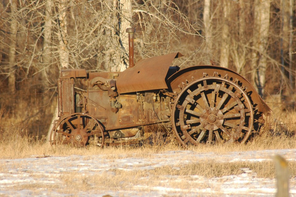 Rust in peace - an old tractor (not sure of the make, so won't guess) sits at the edge of a field, it's working days long gone Les Dunford WN