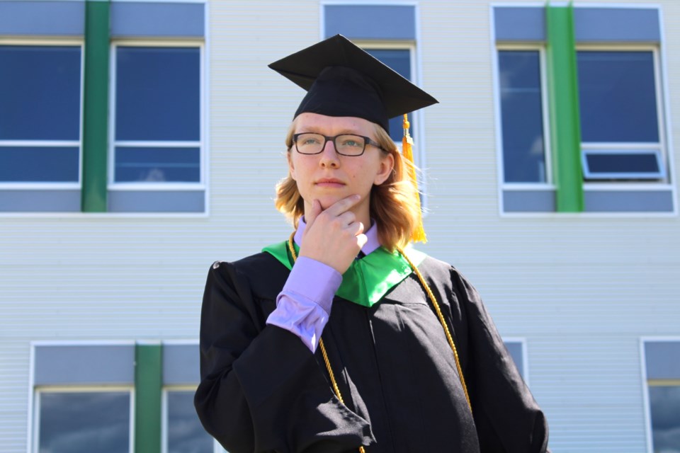 Edwin Parr Composite School's 2021 valedictorian Kai Day ponders the future, existence, and how all of human history led to this exact moment in time, just minutes before his June 25 commencement ceremony at the school, where he and 112 of his classmates received their diplomas.