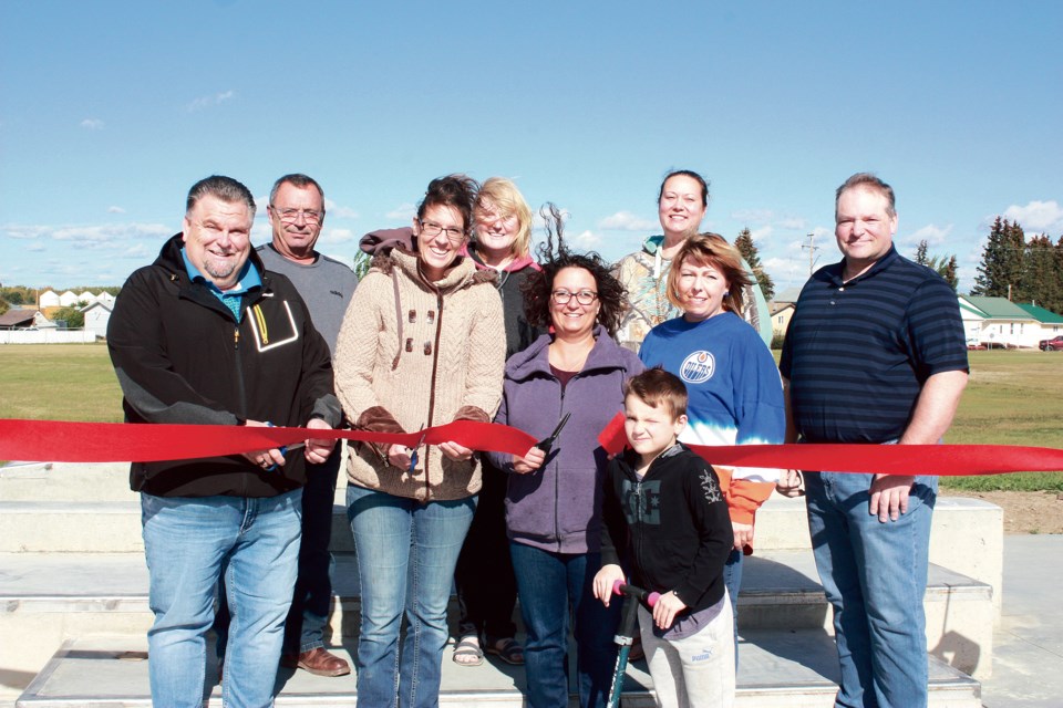 Back (L-R) Sponsors Mark Stanton and Michelle Addo from Pembina Pipelines, along with Coun. Barb Smith. Front (L-R) mayor Colin Derko, GACF members Terryl Turner and Lindsay Stanton, Aspen View board chair Candy Nikipelo and CAO Warren Griffin cut the ribbon to officially open the new Boyle skatepark Sept. 24 at Mill View Park. In front of the ribbon on his scooter is Wyatt Sheen, one of dozens of local kids there for the event to show how’ll they’ll be making good use of the new recreational amenity for years to come. 