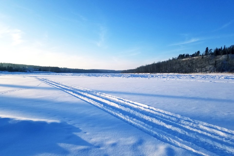 Snowmobile tracks on Athabasca River Daniel Schiff