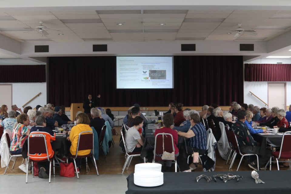 Leah David of the Alberta Emergency Management Association (AEMA) makes a presentation on emergency preparedness at an FCSS community dinner at Westlock Memorial Hall.
