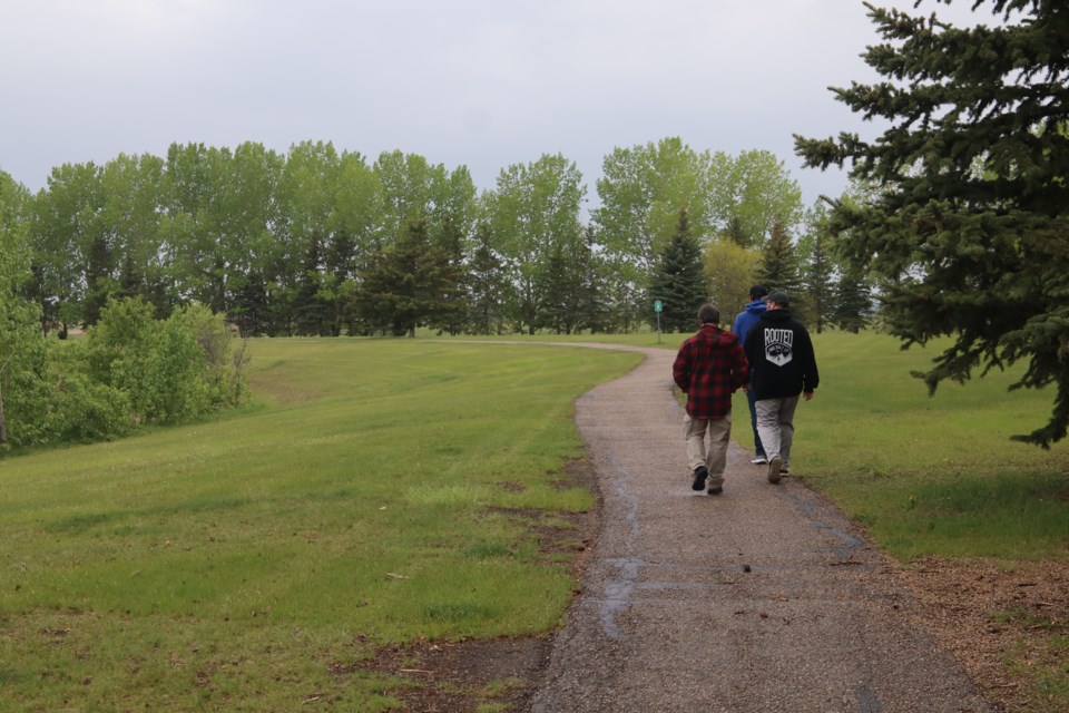 The first men's walk and talk takes place near the Whisselville Pond-Lagoon.