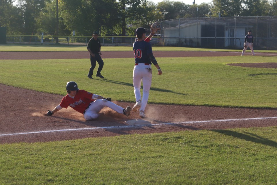 The Westlock Red Lions Teron Callihoo slides into third base against the Parkland Twins in game one of the NCABL finals on Aug. 22.