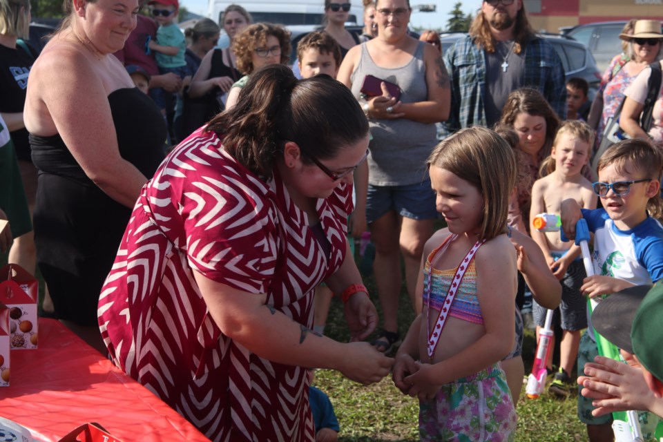 Ivy Hodgins from the U7 soccer girls accepts the sportsmanship award at the Westlock Soccer Association year-end party at the Ecole Westlock Elementary School on June 26.