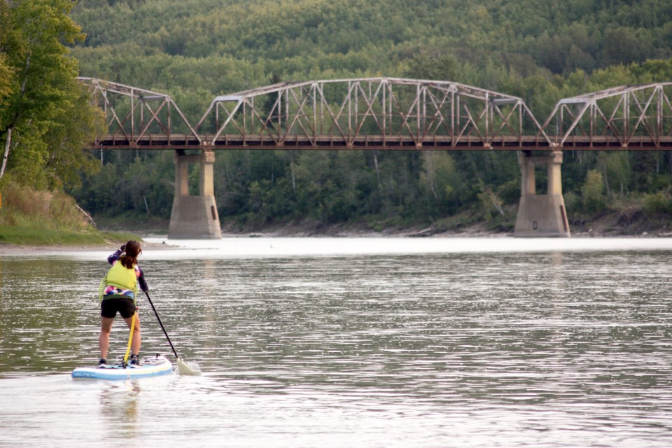 Athabasca welcomed well over 100 athletes to town, most of them from afar, to take part in the Kapâwinihk Wilderness Triathlon, which is quickly gaining popularity as a challenging and unique event that showcases not only the athleticism of the athletes, but the Athabasca area, as well. The third edition of the triathlon went off Sept. 11 with bikers, paddlers and runners competing with the clock. Stephanie Martin was the first in the water following the bike portion through Muskeg Creek Trails.