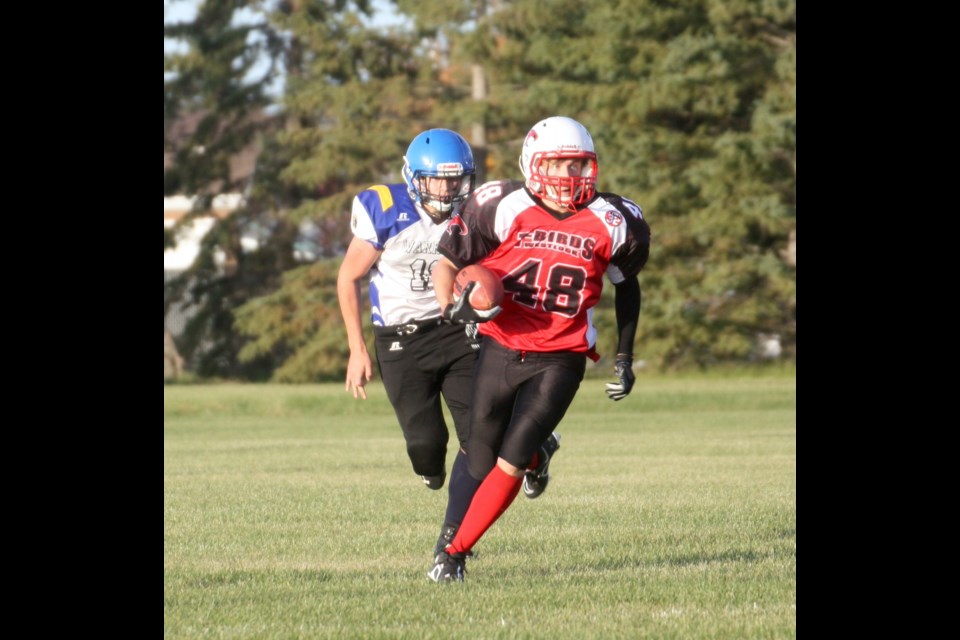 Westlock Thunderbirds player Dylan Marko runs with the ball down field during their game against the Drayton Valley Warriors Sept. 27. The T-Birds lost a close 39-32 battle.