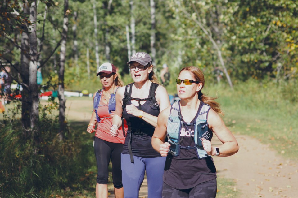 Athabasca trio Tabitha Stewart, Trisha McGregor and Tammy Morrison head off on the running portion of the Kapâwinihk Wilderness Triathlon Sept. 11 at River Meadows RV Park, north of Athabasca, after completing the bike portion on the Muskeg Creek Trails and eight kilometres on their paddleboards up the Athabasca River. There were 98 registered competitors, plus about 25 others, who took in the day outdoors, and organizers are hoping they’ll all come back next year and bring a friend with them. 