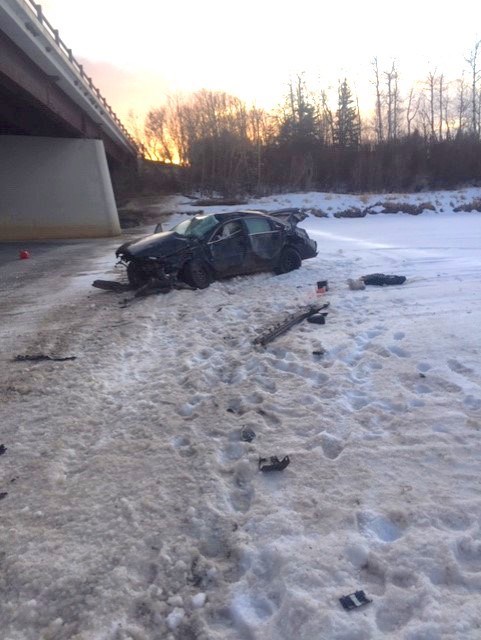A vehicle which drove off Highway 664 near the Lunnford Bridge came to rest in the middle of the frozen Pembina River on the evening of March 18.